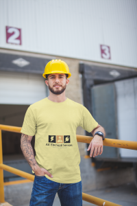 a man wearing a yellow hard hat with yellow t shirt saying electricians in calgary